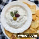 Velvety Roasted Olive Spread 8 roasted olive dip above in white bowl