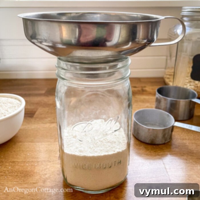 Snickerdoodle Cookie Mix Gift Jar with Wholesome Oat and Whole Wheat and Printable Tags 7 Adding oat-ww snickerdoodle cookie mix ingredients to jar