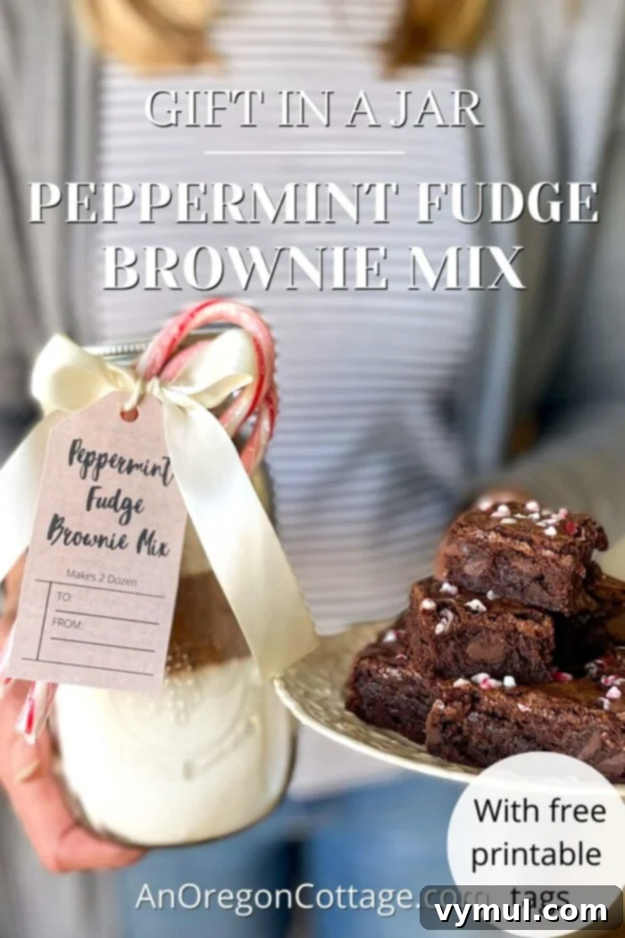 Peppermint Fudge Brownie Mix in a Jar ready for gifting, adorned with a bow and tag.