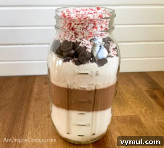 Peppermint brownie mix ingredients neatly layered in a mason jar.