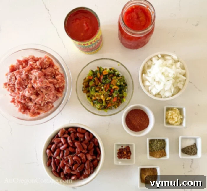 Effortless Chili For Any Cooker 4 chili ingredients on white counter
