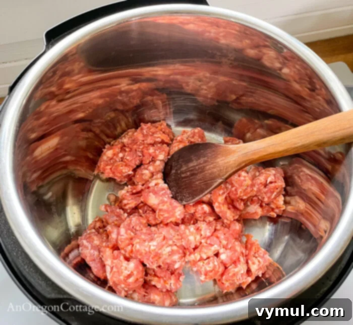 Effortless Chili For Any Cooker 5 browning meat in Instant pot