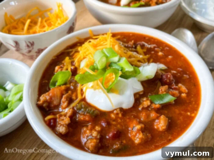 Effortless Chili For Any Cooker 7 chili in bowl with toppings