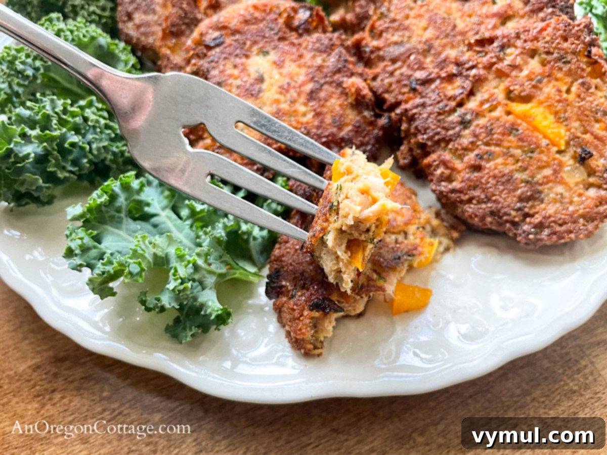 Effortless 15 Minute Tuna Patties Healthy Breadcrumb Free Keto Paleo Gluten Free 9 bite of tuna patty on fork above