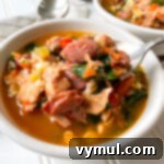 Quick Cajun Chicken Barley Harvest Soup 9 Cajun Chicken Barley Vegetable Soup on spoon in bowl