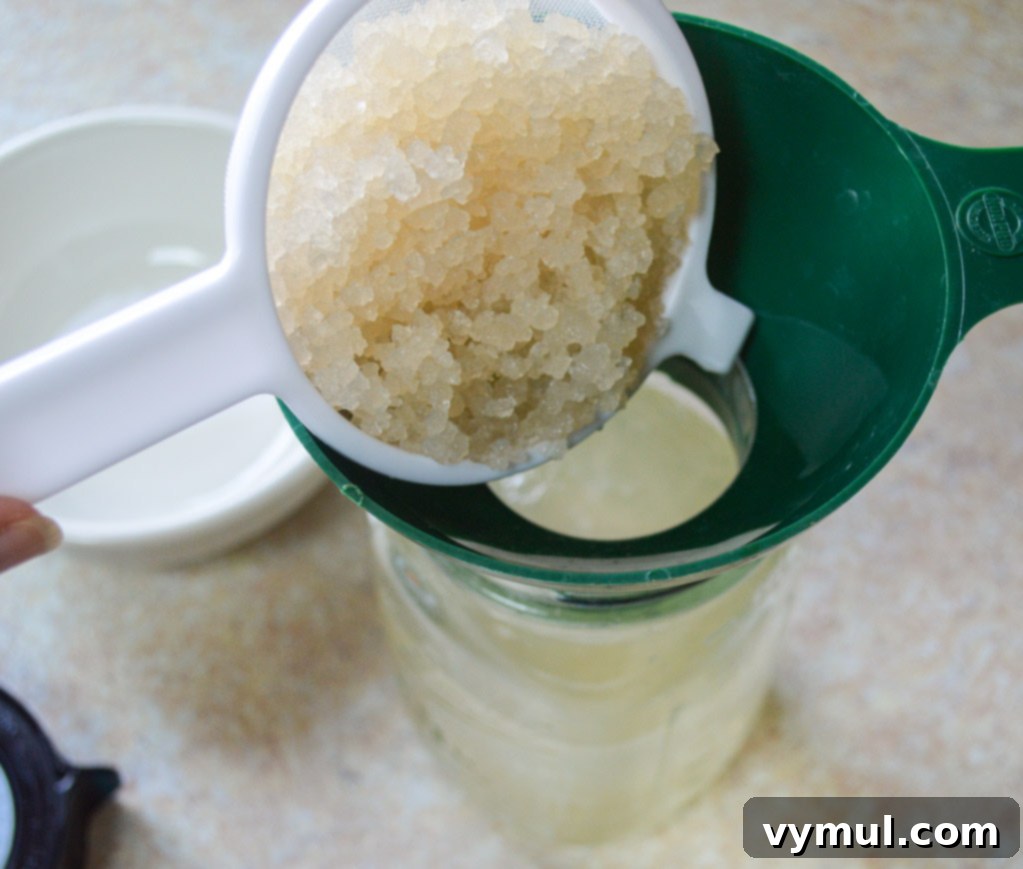 Homemade Water Kefir Made Easy 5 Adding water kefir grains to a jar of sugar water