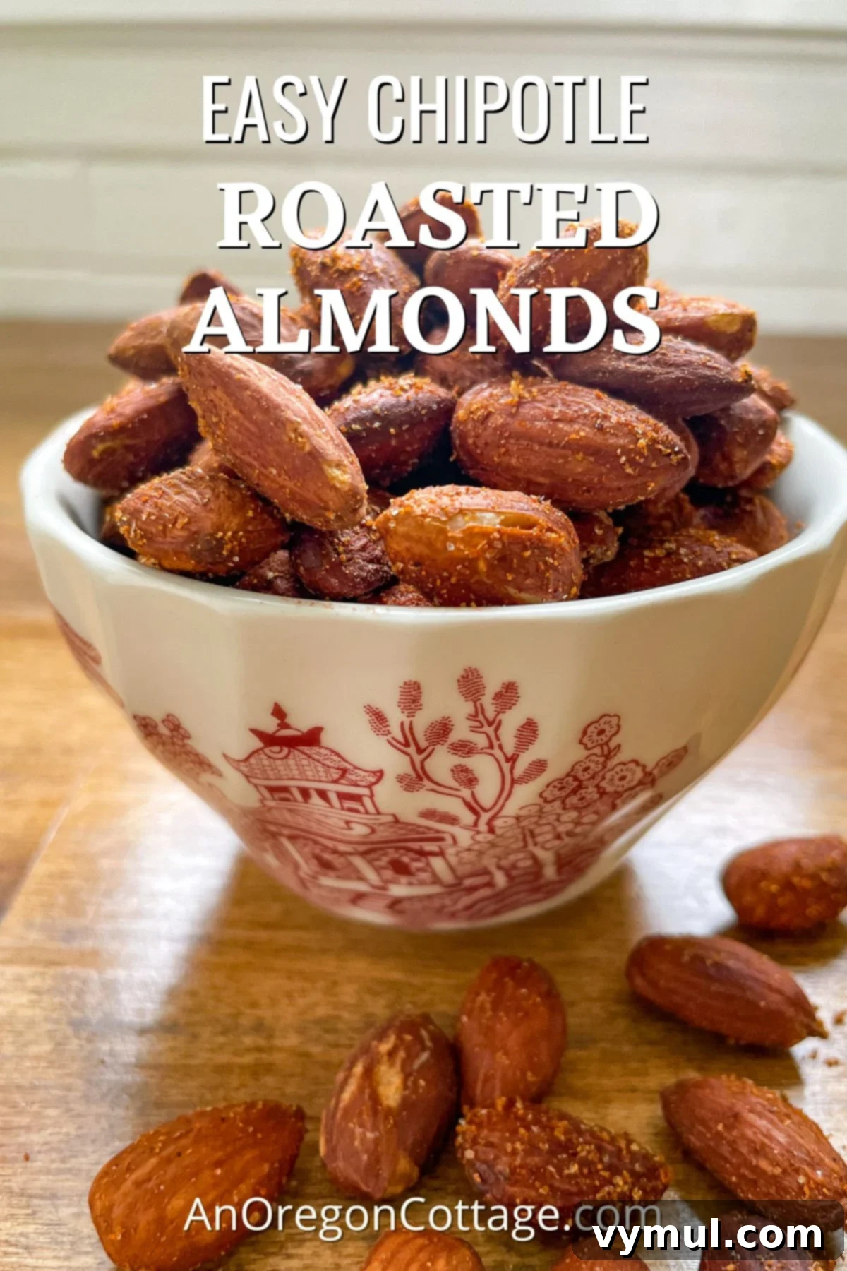 Chipotle Fire Almonds: Quick & Sugar-Free 2 easy chipotle spiced roasted almonds in red transferware cup, ready to be enjoyed as a healthy snack or salad topping
