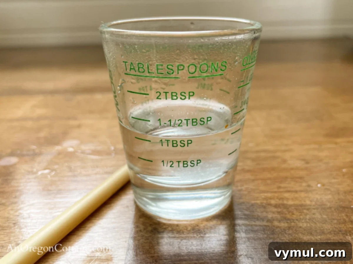 Chipotle Fire Almonds: Quick & Sugar-Free 4 salt water in glass tablespoon measure, preparing the secret to perfectly seasoned almonds