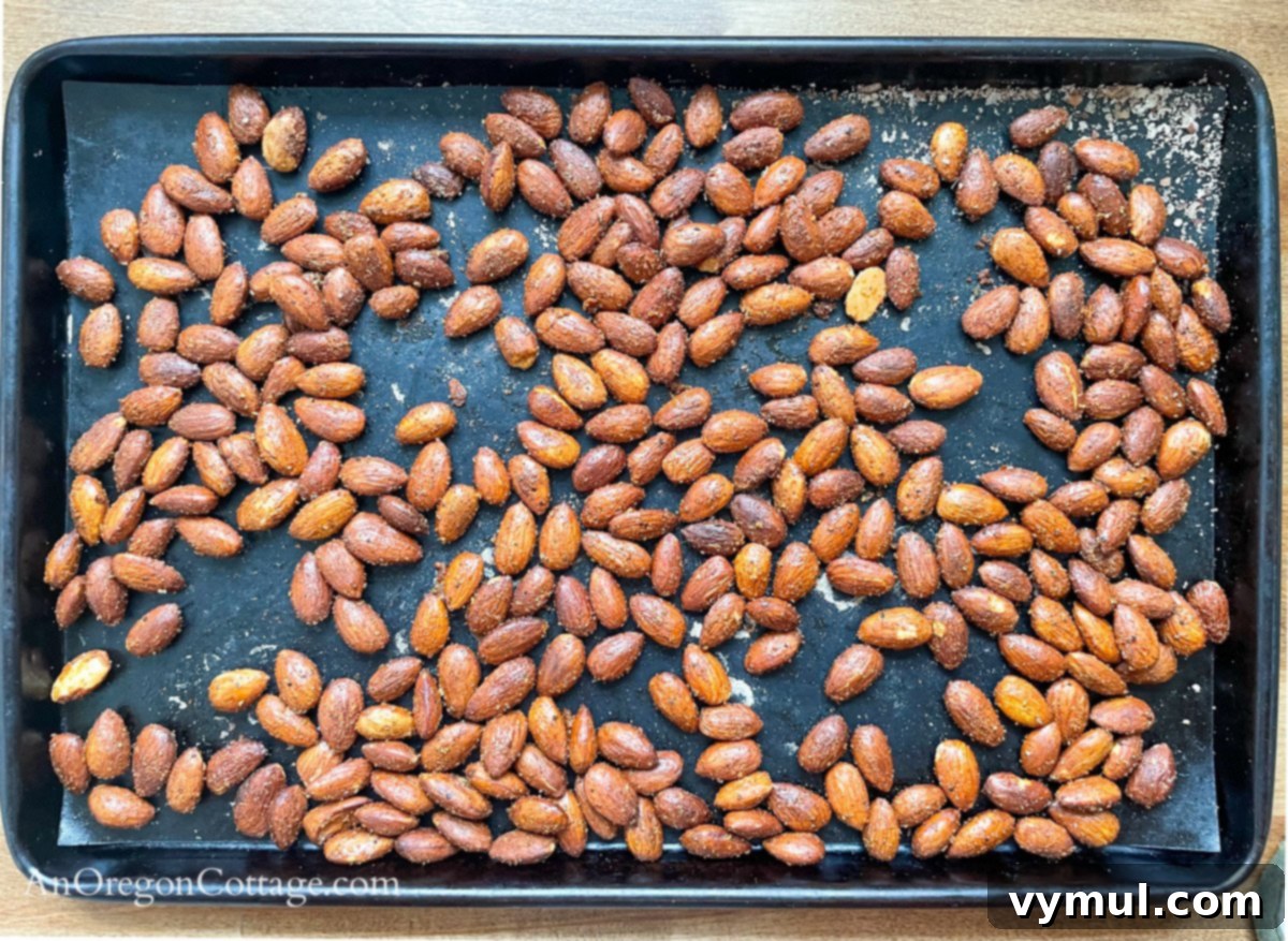 Chipotle Fire Almonds: Quick & Sugar-Free 7 chipotle almonds cooling on a baking pan after seasoning, ensuring optimal crispness