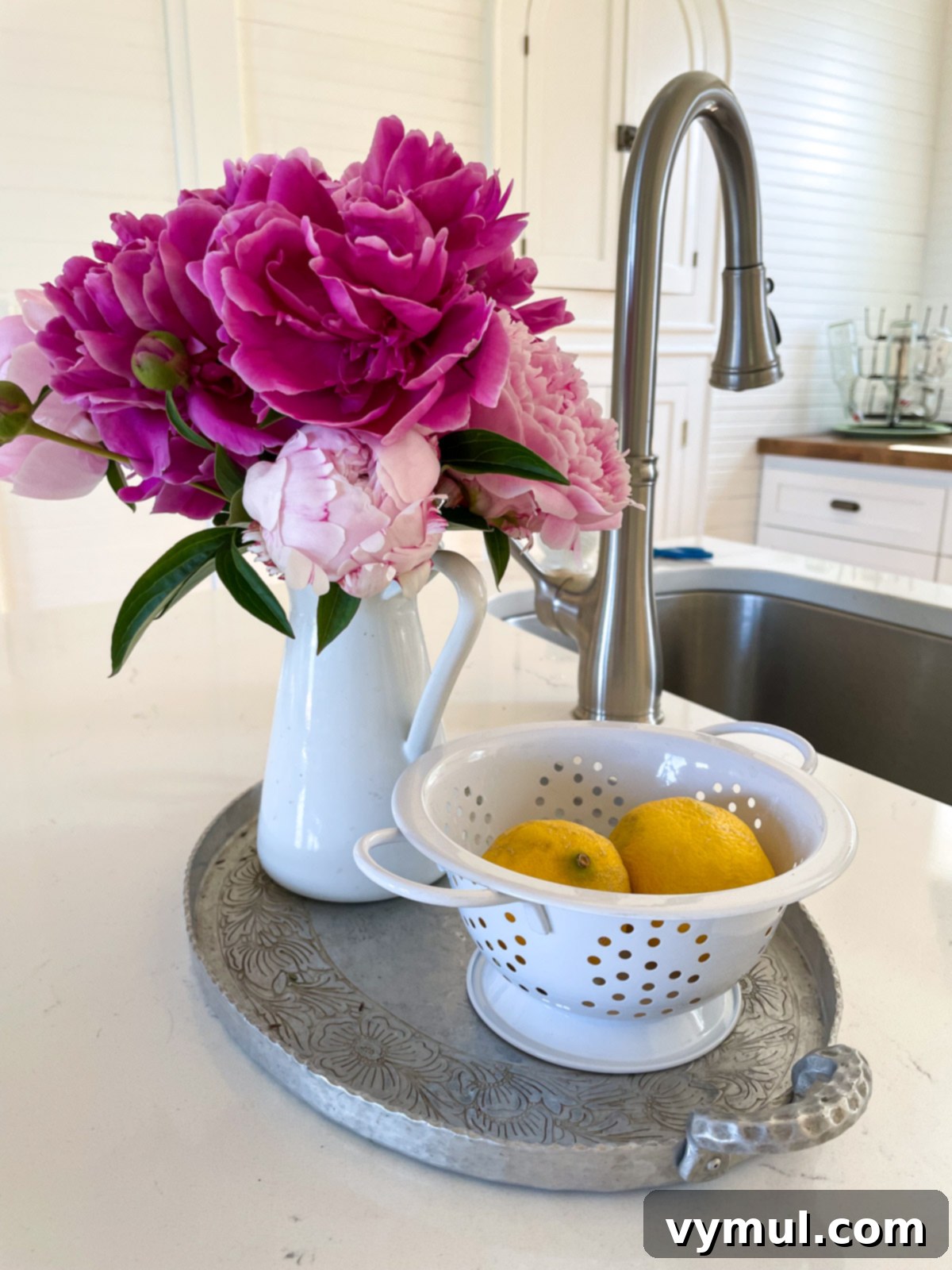Sixty-Two Tiny Joys: From Peonies to Pristine Panes and Beloved Books 3 pink peonies in white kitchen vase