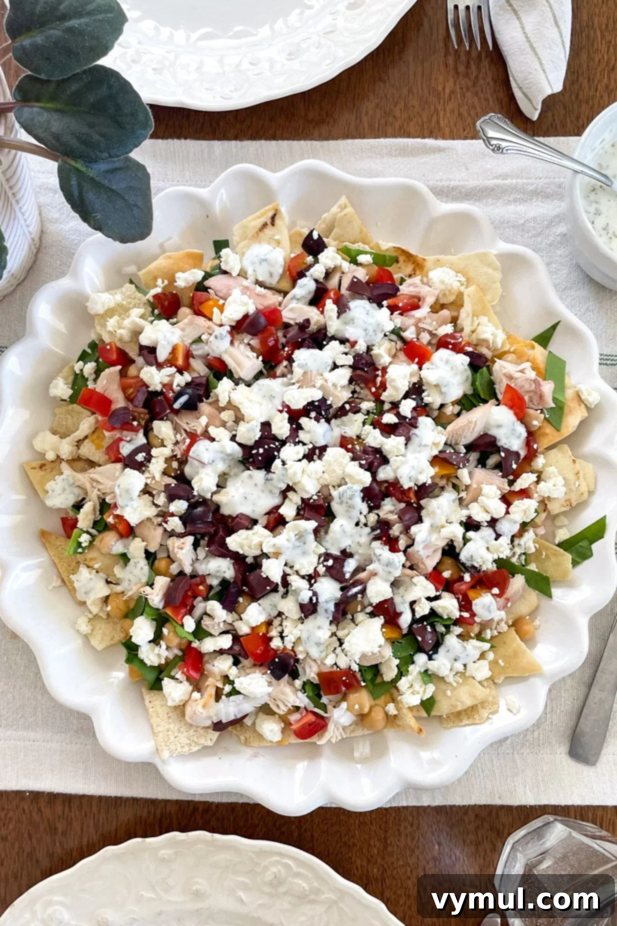 15-Minute No-Bake Greek Nachos 2 Greek nachos on white platter from above