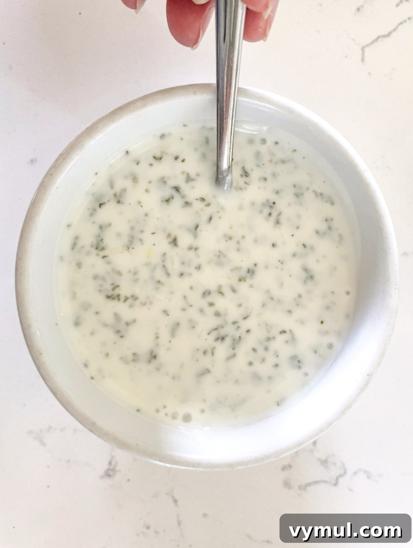 15-Minute No-Bake Greek Nachos 4 Mixing yogurt sauce ingredients