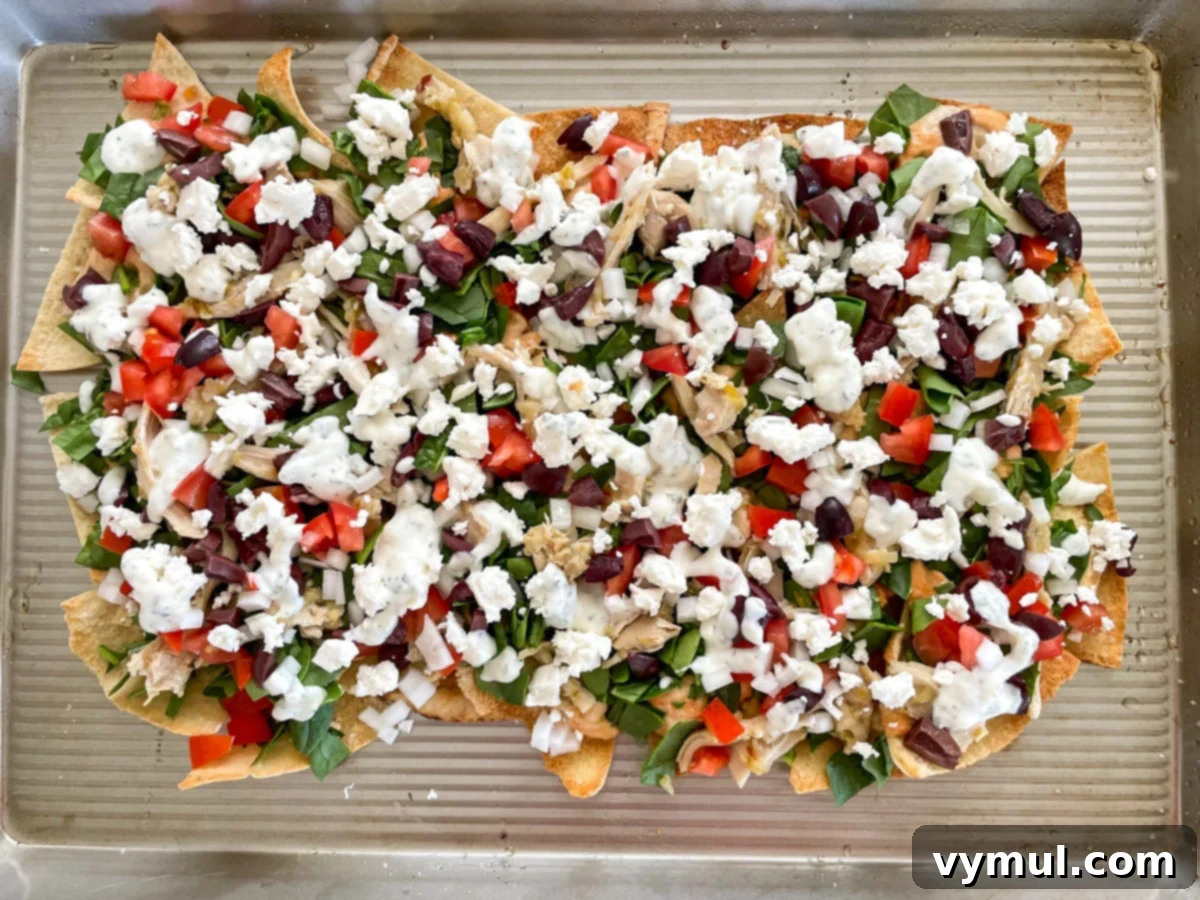 15-Minute No-Bake Greek Nachos 9 pita nachos on baking sheet