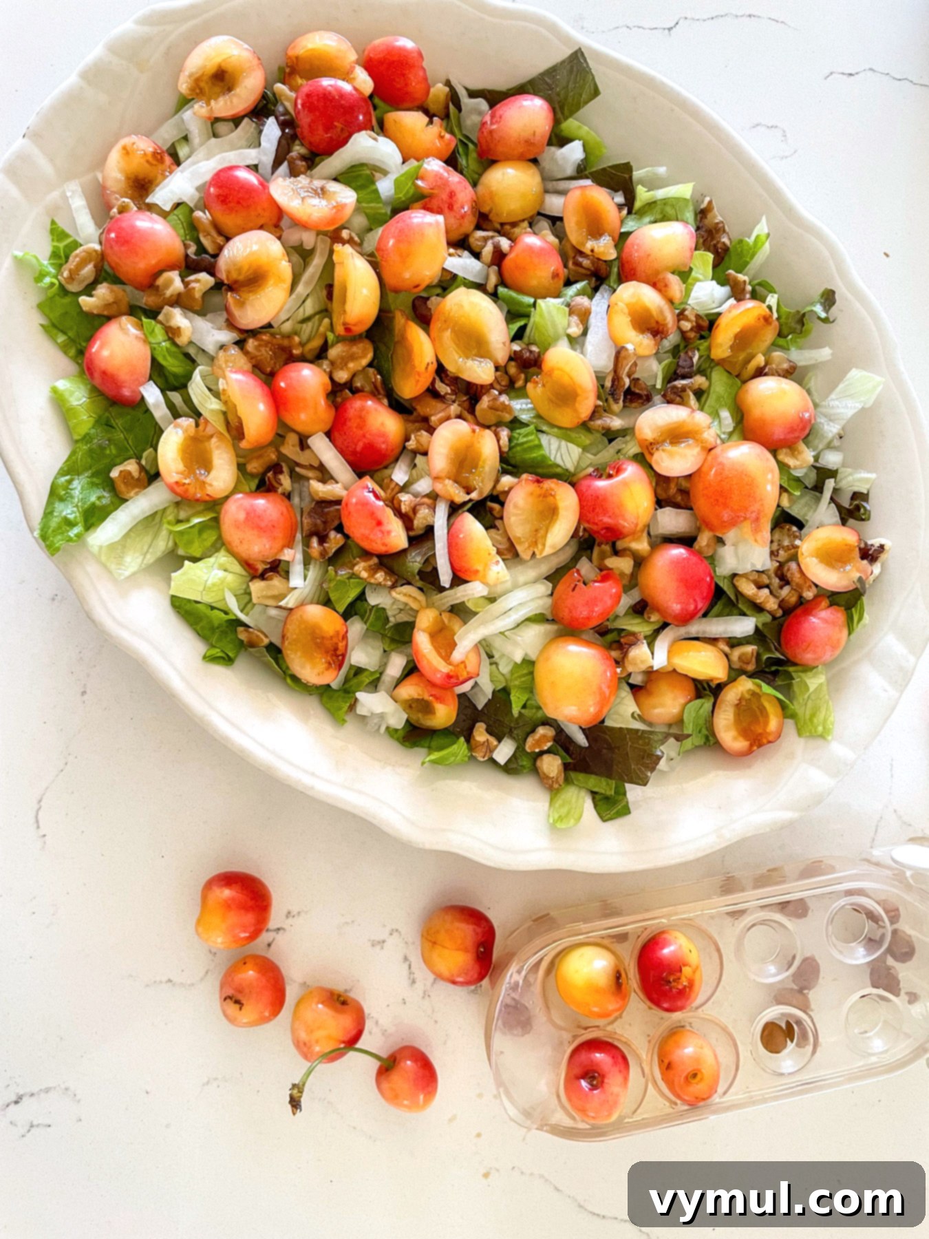 Sweet Cherry, Feta & Walnut Medley 6 Pitting and layering cherries onto salad on platter