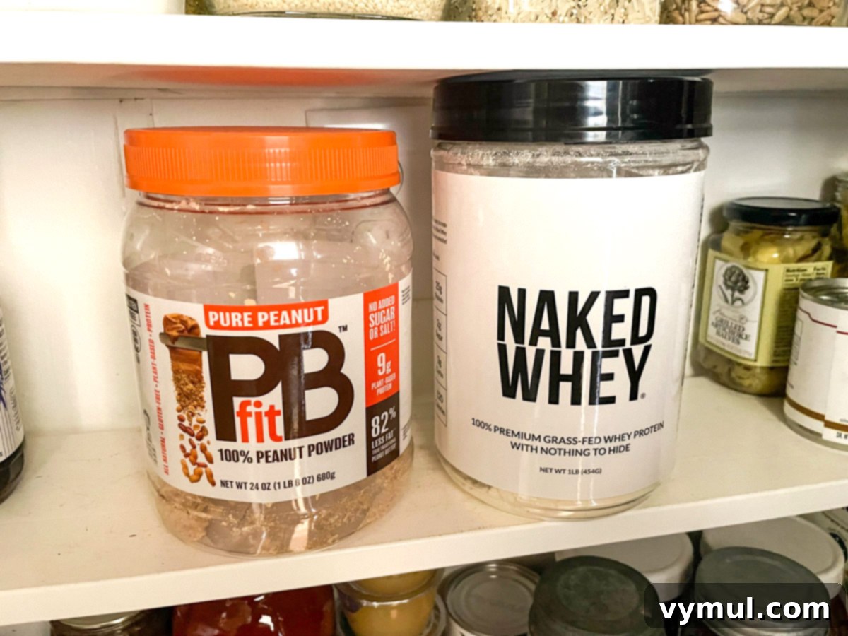 Autumn's Bounty: Garden Gifts, Wellness Essentials, and Enriching Reads 5 PBfit and Naked Whey protein powder containers on a shelf