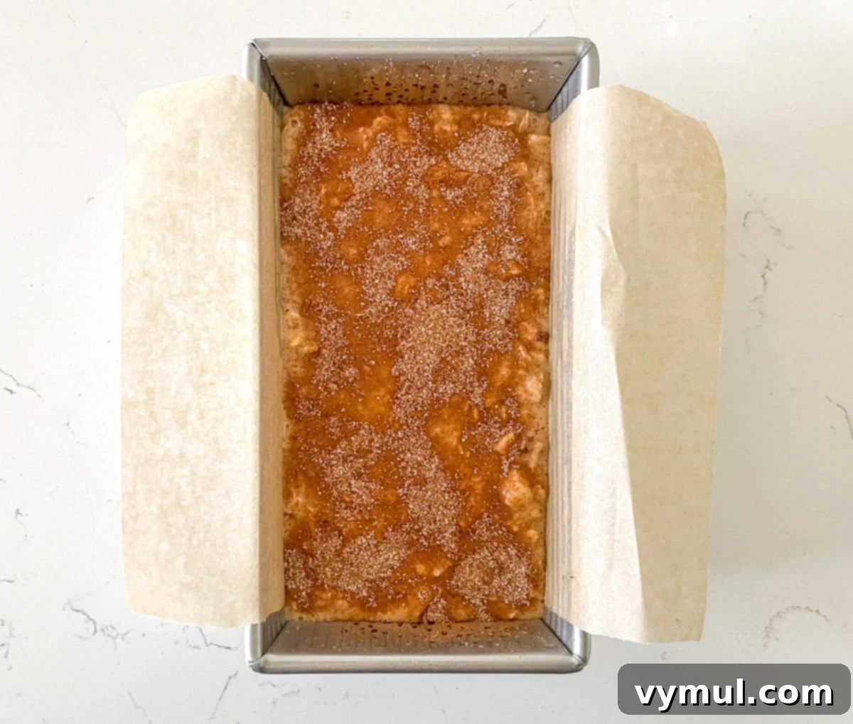 Easy Wholesome Honey Cinnamon Apple Oat Loaf 6 Unbaked apple bread dough in a loaf pan, topped with cinnamon sugar