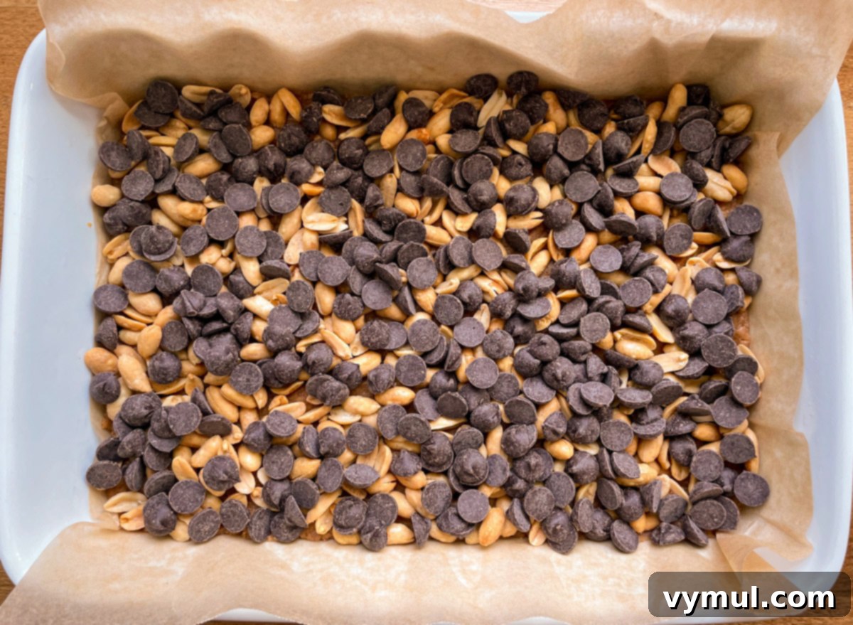 No-Bake Gluten-Free Chocolate Peanut Butter Magic Bars 5 chocolate chip and peanut layer