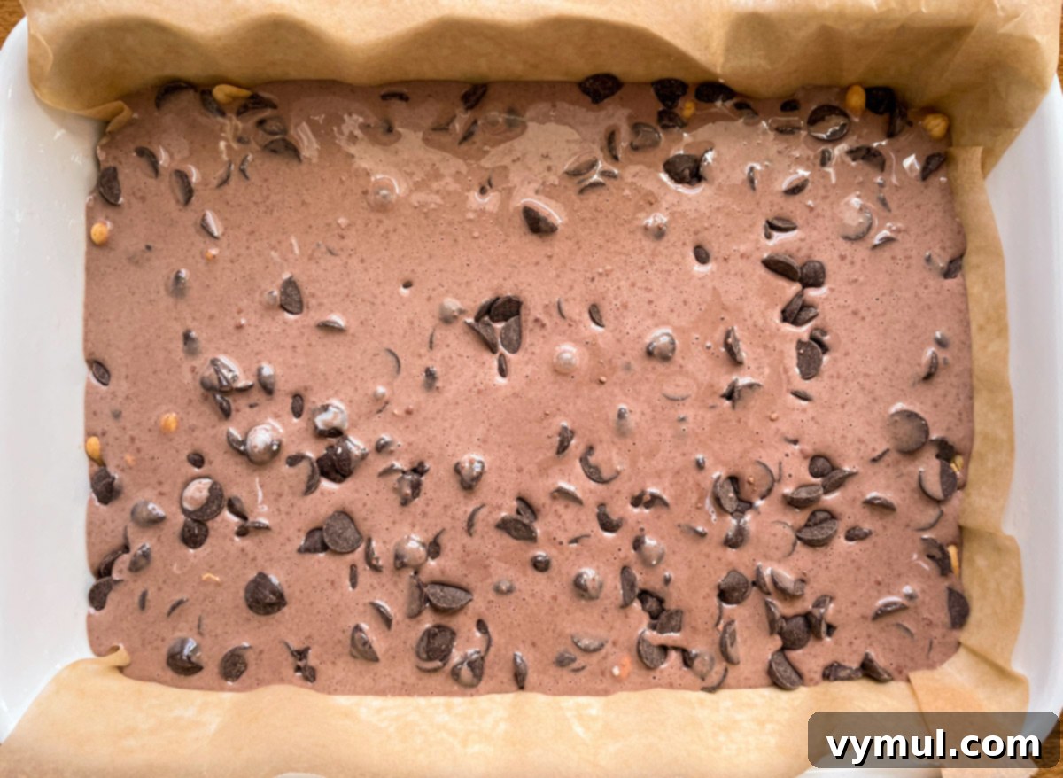 No-Bake Gluten-Free Chocolate Peanut Butter Magic Bars 7 bars with all layers before baking