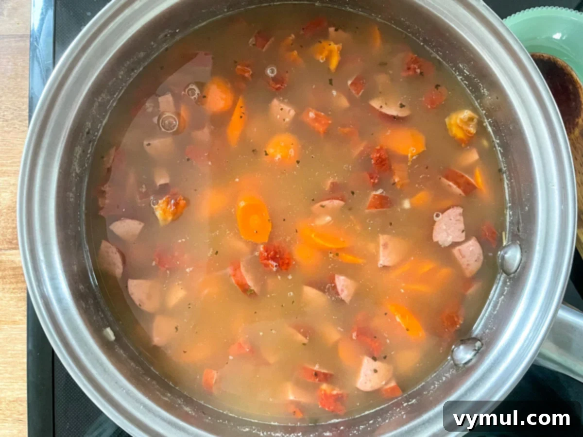 Effortless Homemade Lentil Barley Soup Mix 6 A large pot filled with a rich, bubbling lentil barley soup, simmered to perfection from the homemade mix.