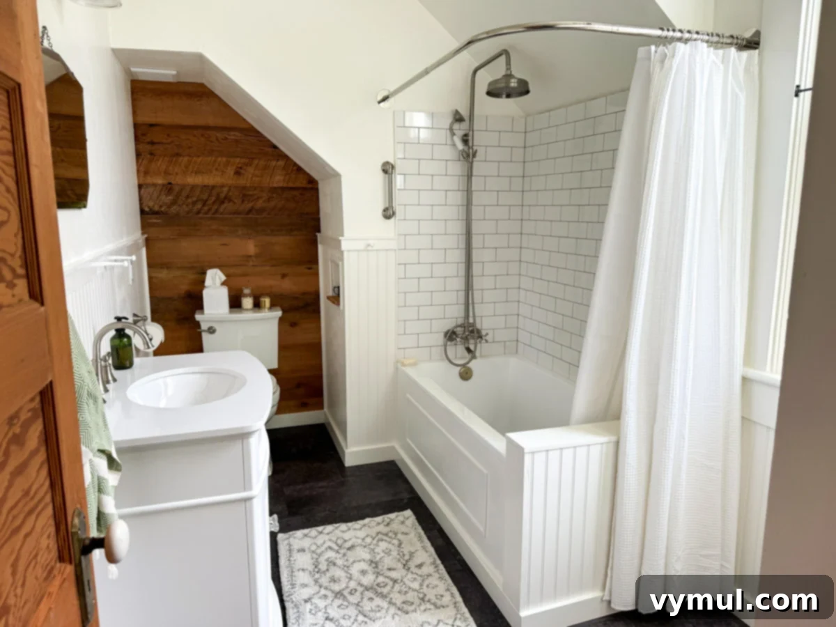 Our Latest Delights Bathroom Transformation Holiday Brunch Austen Puzzle Book Recommendations 3 The newly remodeled upstairs bathroom of a 1900 farmhouse, viewed from the doorway, showcasing a blend of vintage charm and modern functionality.