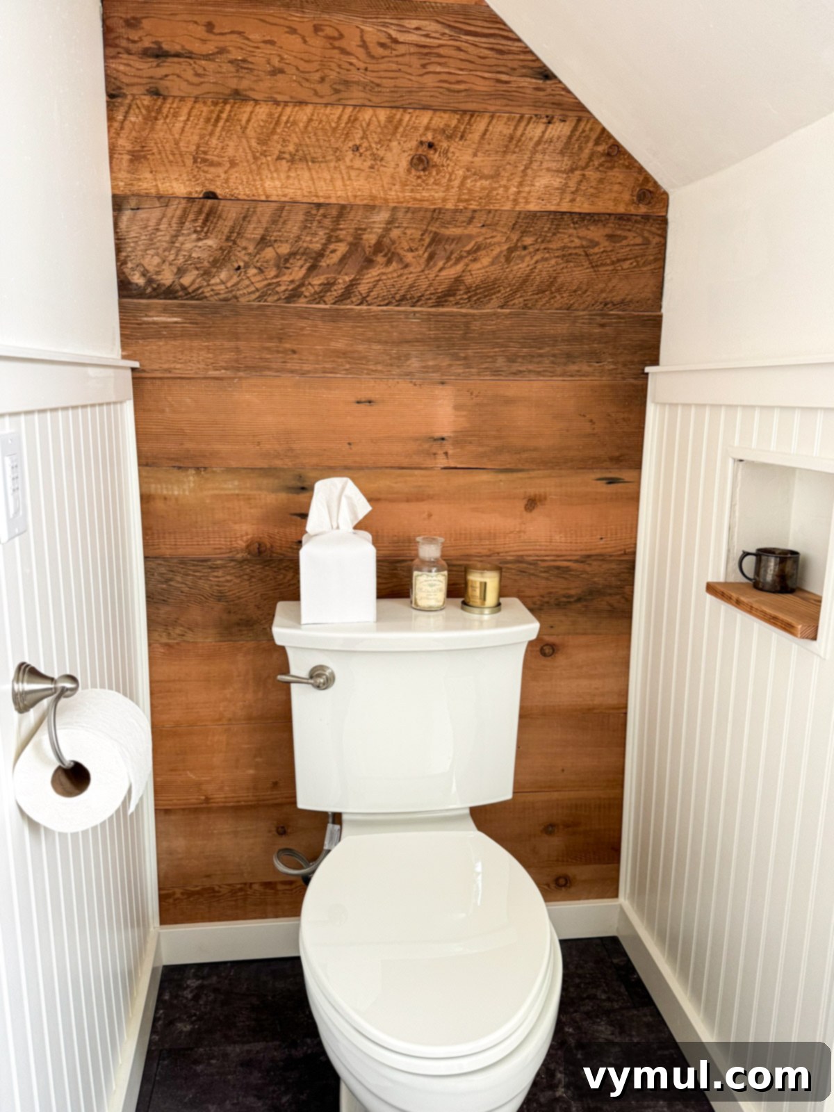Our Latest Delights Bathroom Transformation Holiday Brunch Austen Puzzle Book Recommendations 5 A renovated farmhouse bathroom featuring a reclaimed wood accent wall behind the toilet, complemented by classic beadboard walls, adding rustic charm.