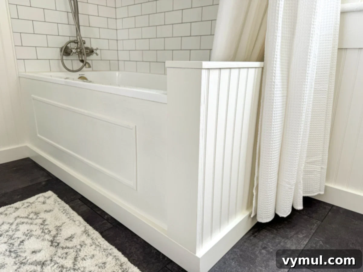 Our Latest Delights Bathroom Transformation Holiday Brunch Austen Puzzle Book Recommendations 7 Close-up detail of a custom wood tub surround in a remodeled bathroom, highlighting craftsmanship and natural materials.