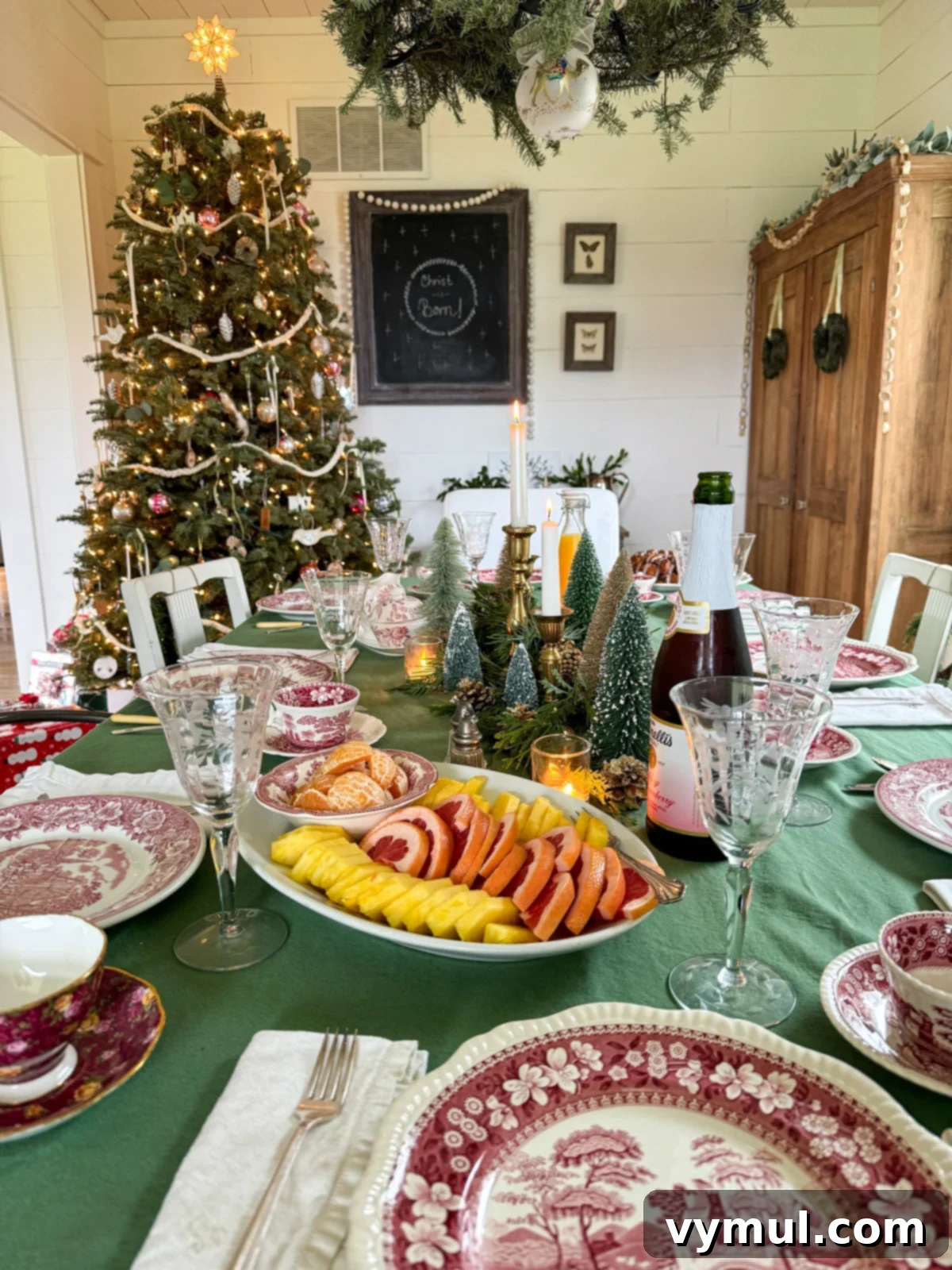 Our Latest Delights Bathroom Transformation Holiday Brunch Austen Puzzle Book Recommendations 9 A beautifully set Christmas brunch table adorned with festive decorations, red transferware dishes, and etched goblets, ready for a family gathering.