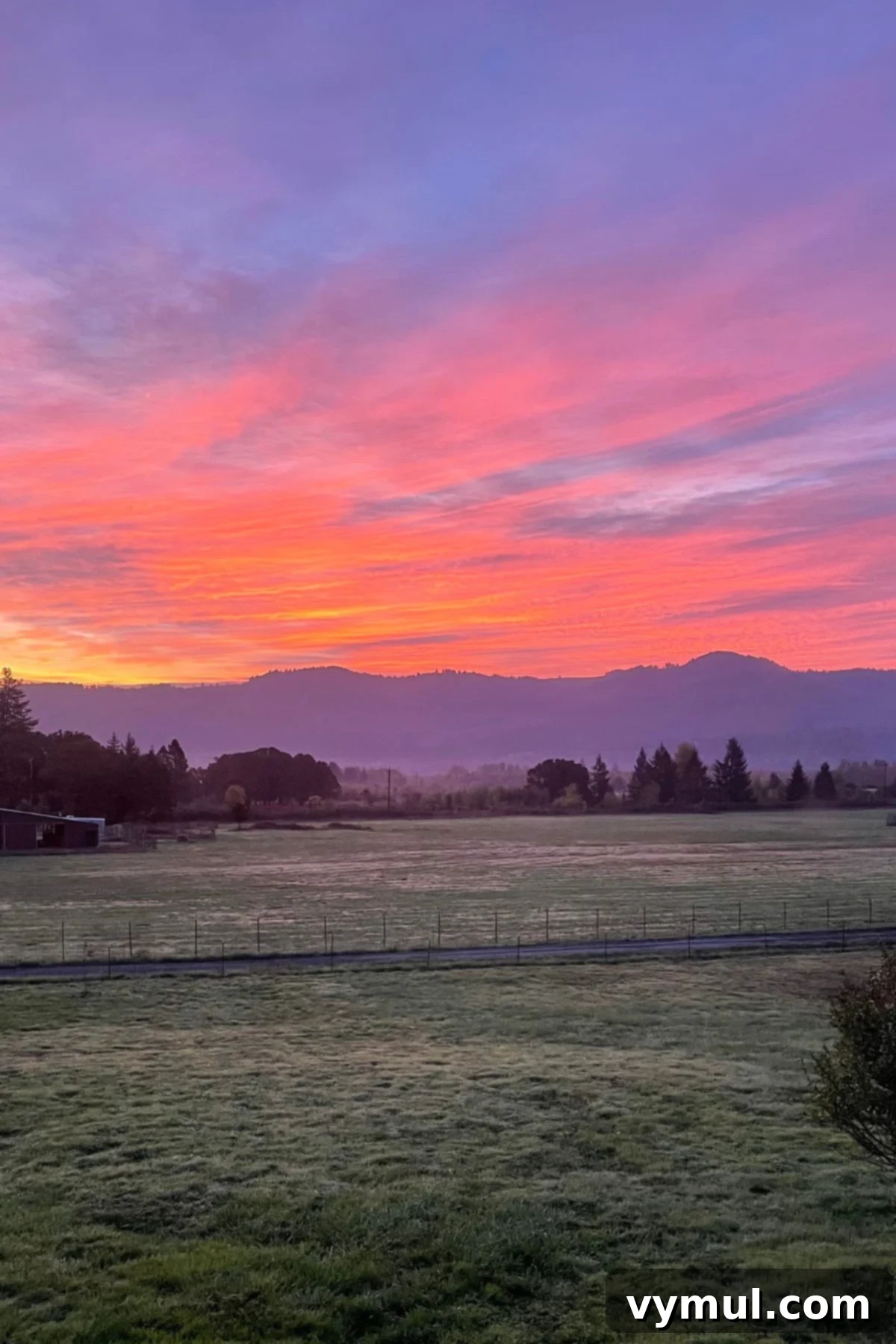 The 12 Gems of 2023 2 pink-orange sunrise over the hills, symbolizing a fresh start and the beauty of discovery