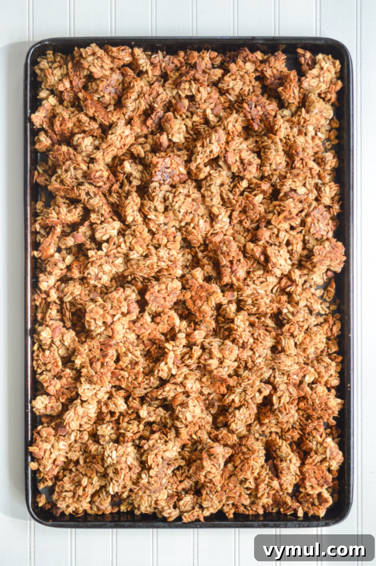 Healthy Quick Maple Honey Granola Bark Clusters 6 Freshly baked maple honey granola cooling on a cookie sheet, ready to be broken into clusters.
