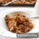Healthy Quick Maple Honey Granola Bark Clusters 7 Homemade maple honey granola in a white bowl, ready for serving.