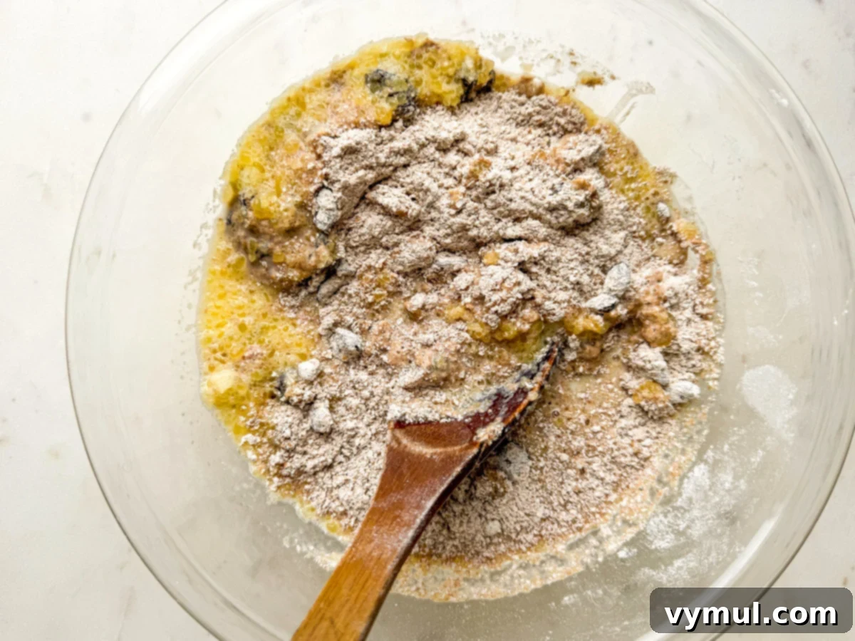 mixing wet and dry ingredients for bran muffins