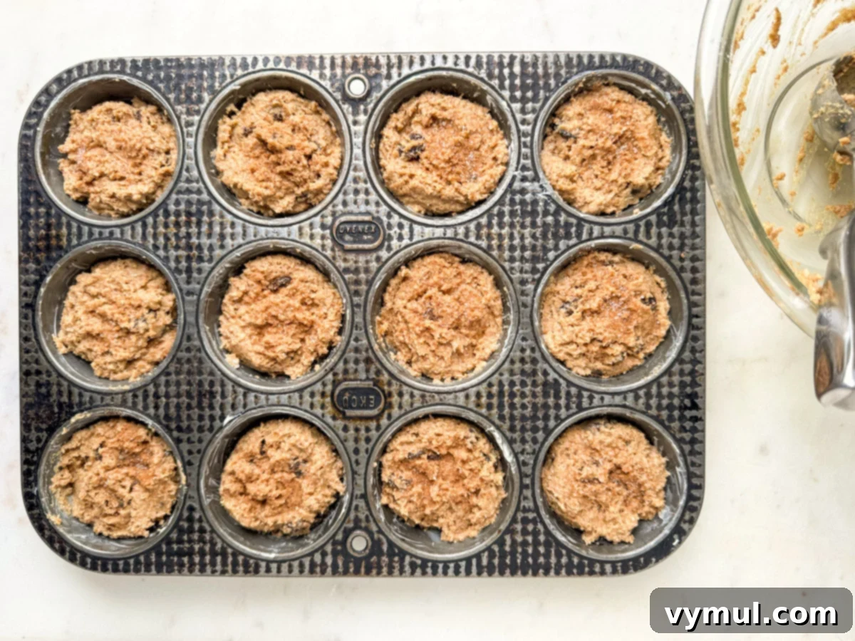filled muffin tin ready to go into oven
