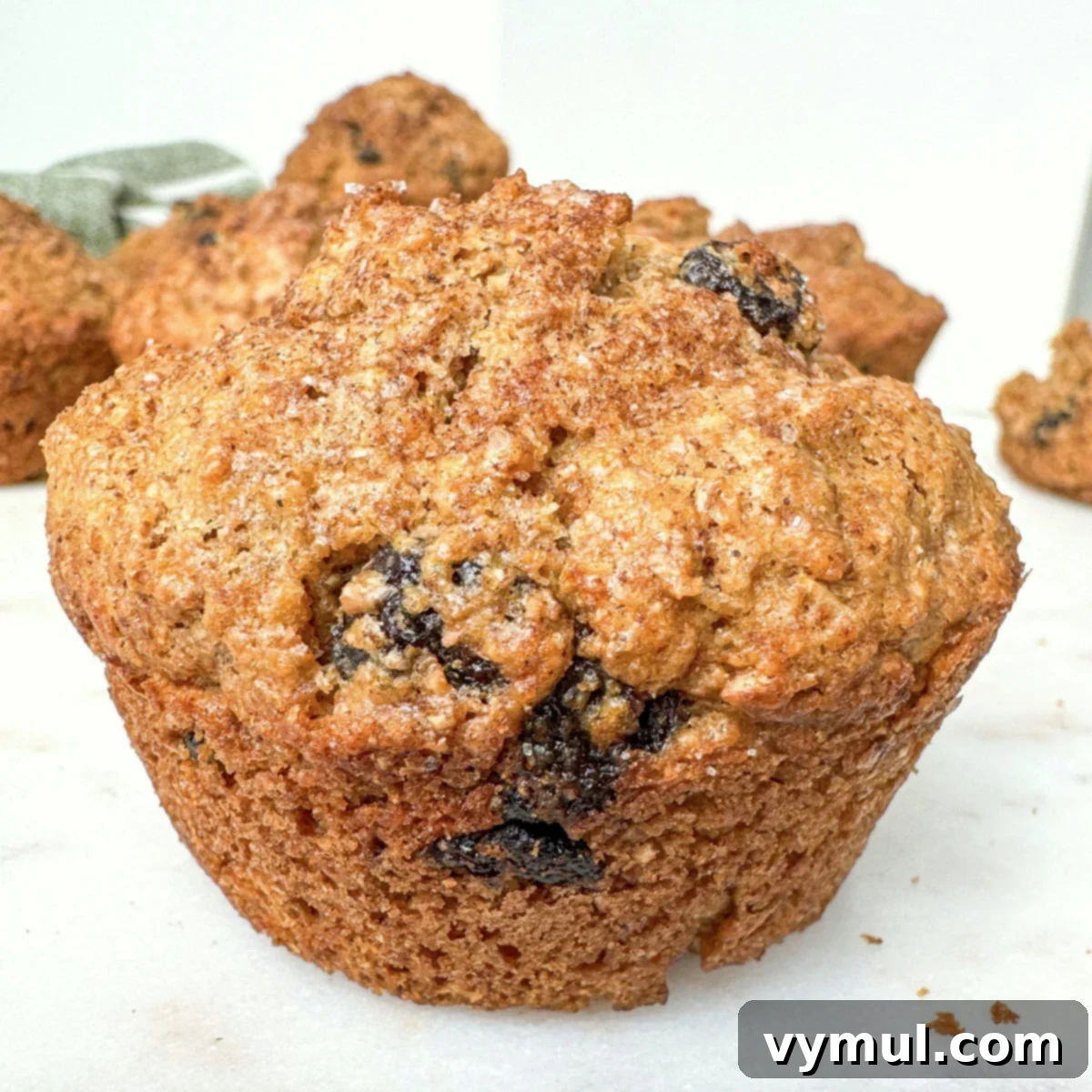 bran muffin close up on white background
