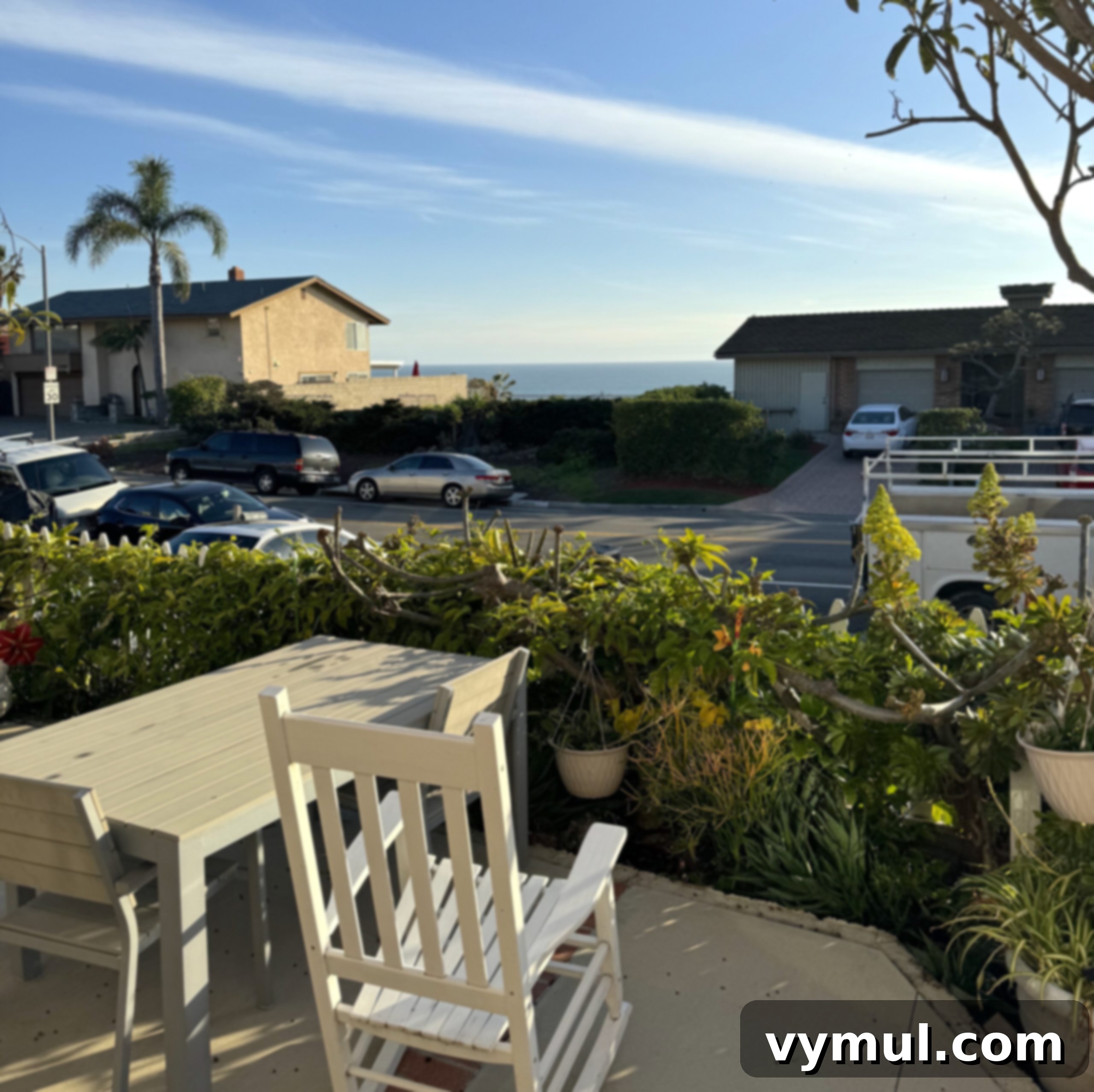 An idyllic view of the Pacific Ocean from a cozy Airbnb patio in Southern California.