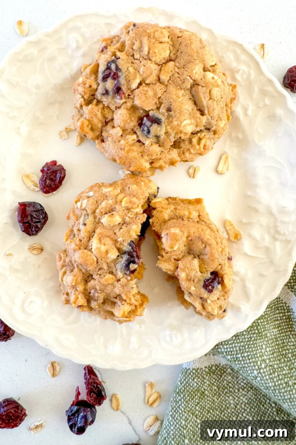 trail mix cookies on white plate above
