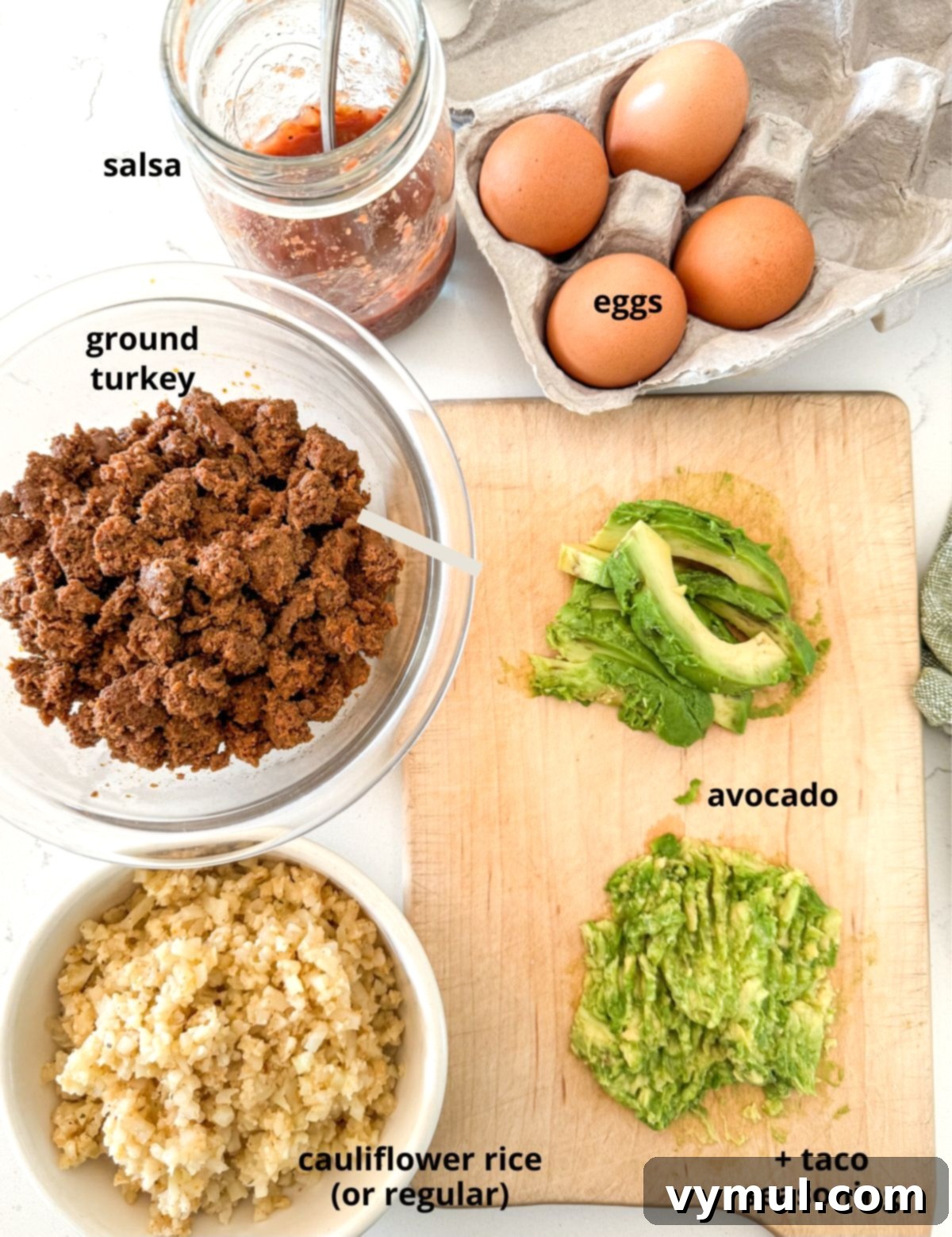 Speedy Six Ingredient High Protein Mexican Breakfast Bowls 3 Arrangement of 6 simple ingredients: ground turkey, taco seasoning, frozen cauliflower rice, avocado, eggs, and salsa, ready for Mexican breakfast bowls.