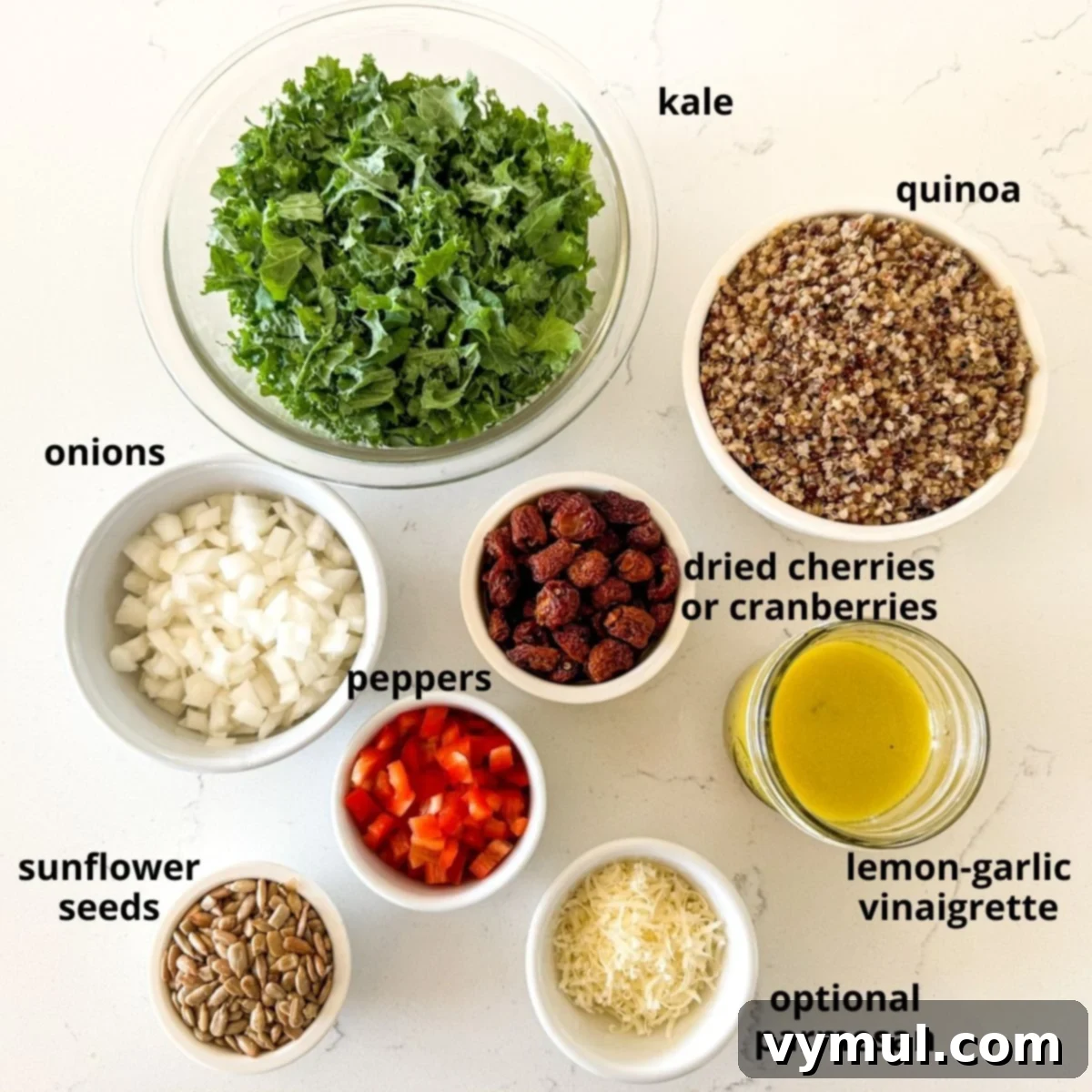 Zesty Lemon and Parmesan Kale Quinoa Salad 3 Labeled ingredients for kale quinoa salad laid out on a white surface.