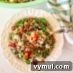 Zesty Lemon and Parmesan Kale Quinoa Salad 10 kale quinoa salad in white bowl