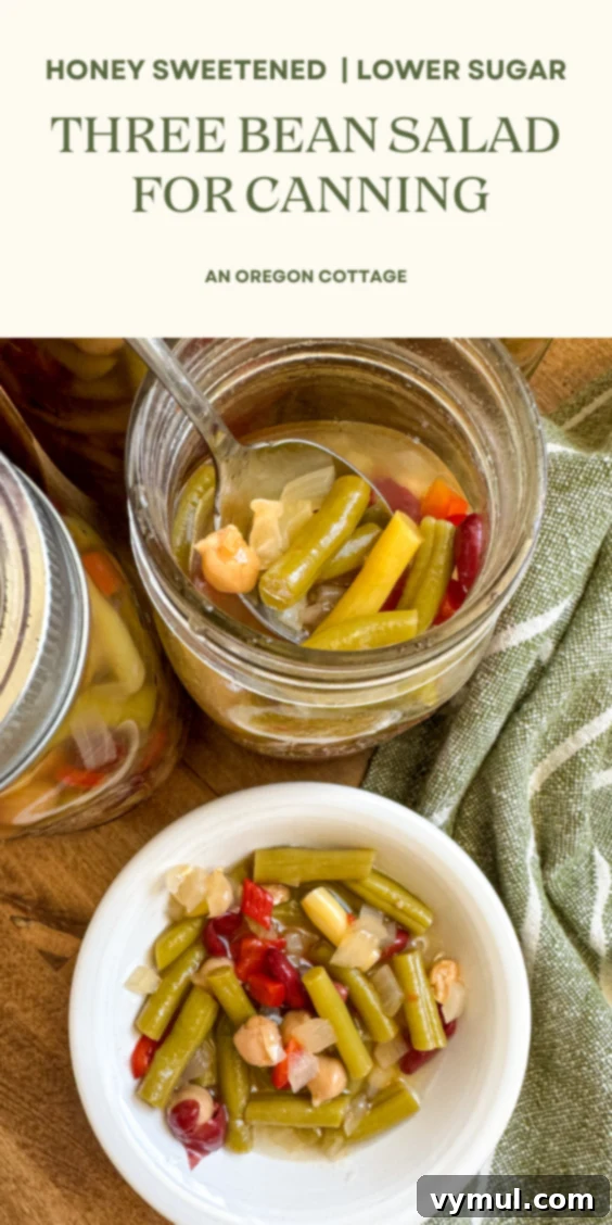 Pinterest image: A jar of honey-sweetened, low-sugar three bean salad, perfect for canning and healthy eating.