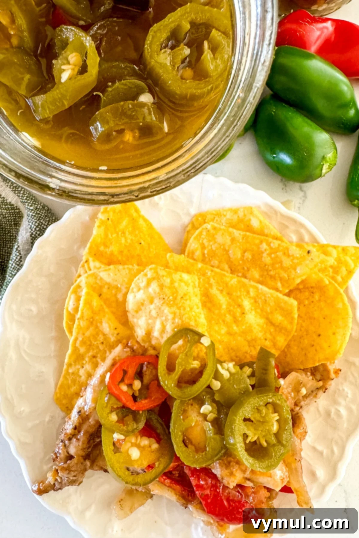 Sweet and Spicy Lower Sugar Cowboy Candy for Easy Canning 10 candied jalapeños on nachos