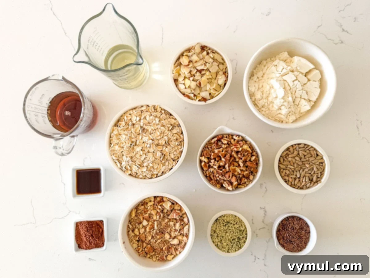 A curated selection of high protein granola ingredients, including oats, various nuts, seeds, and protein powder, neatly arranged on a white counter.