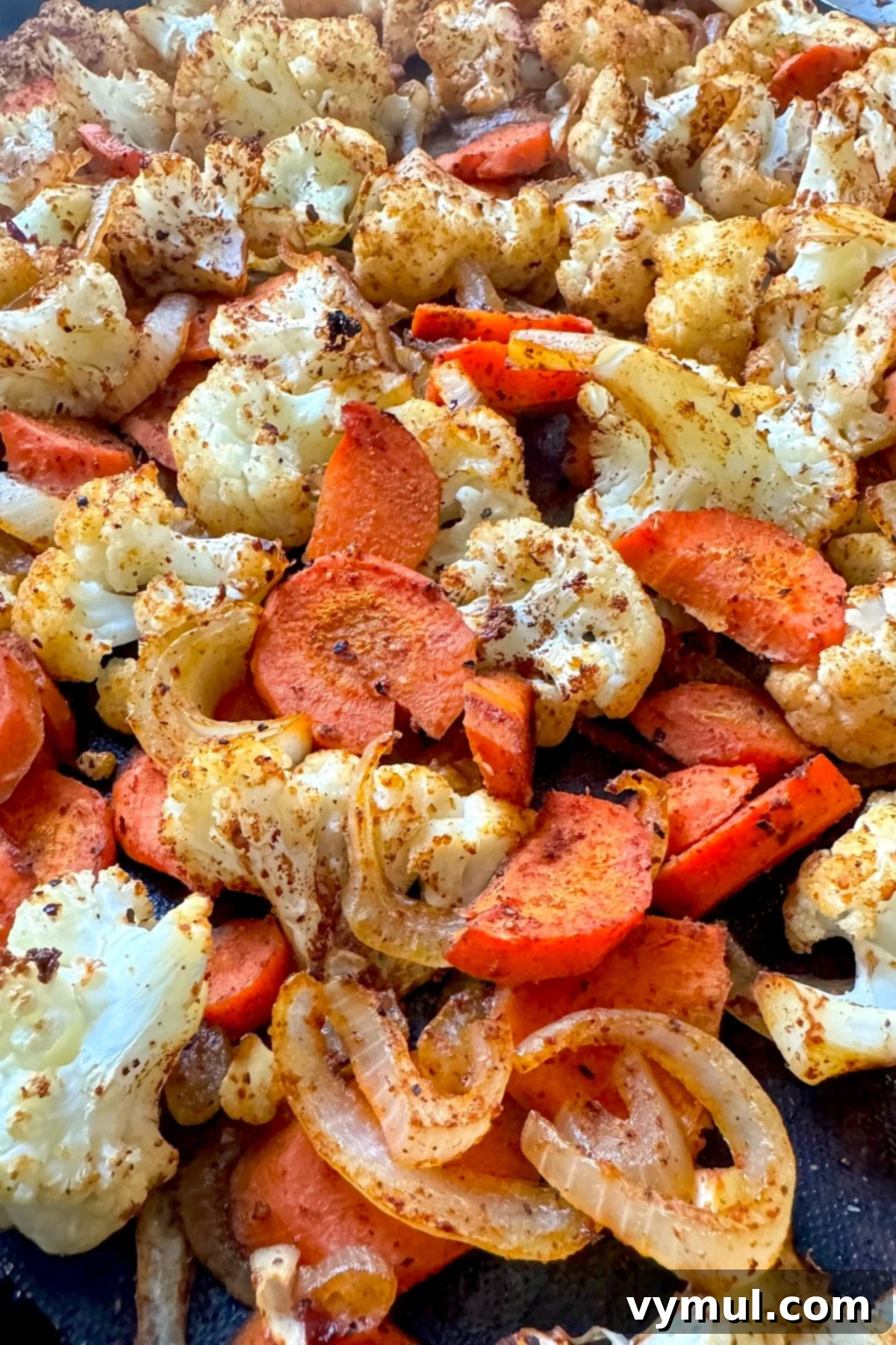 Simple Healthy Chili Roasted Cauliflower and Carrots 6 roasted cauliflower and carrots on baking sheet
