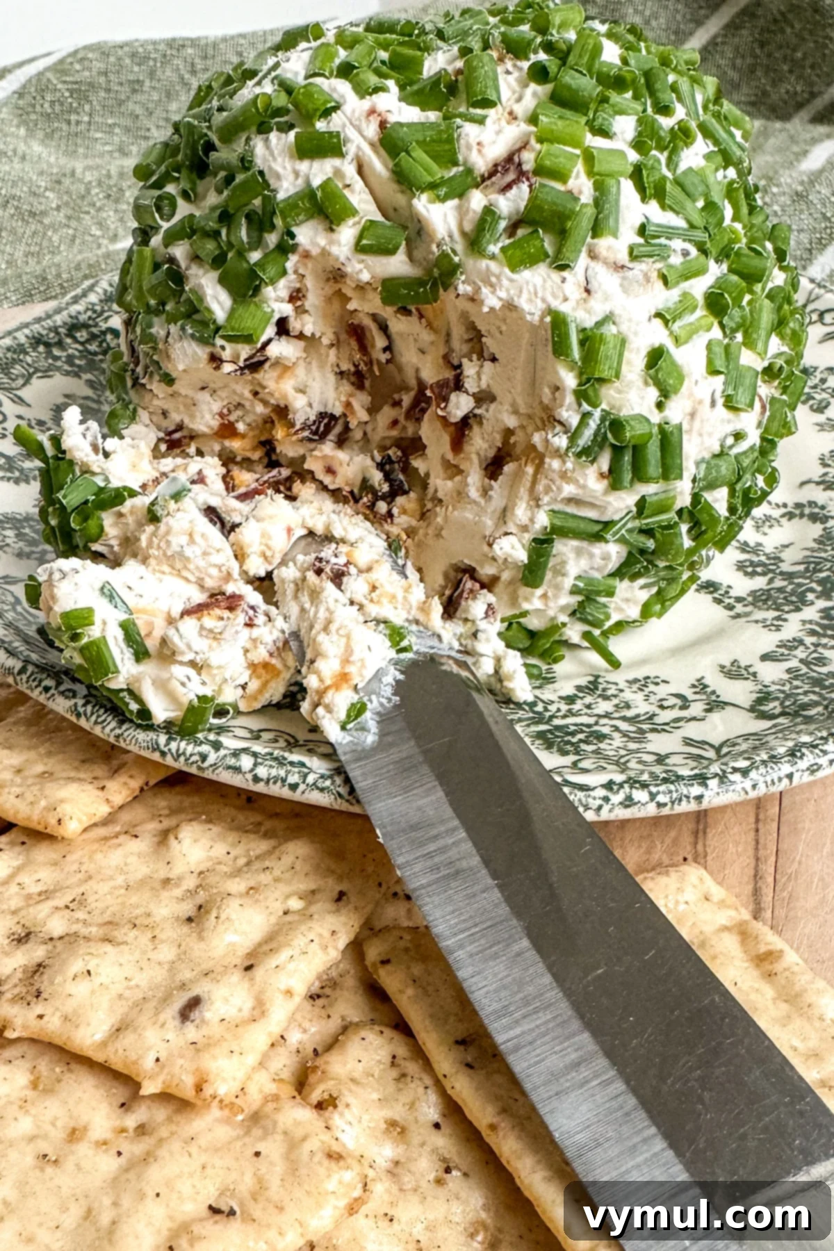 5 Minute Sun Dried Tomato Cheese Ball Quick and Nut Free 2 breaking into simple cheese ball with knife