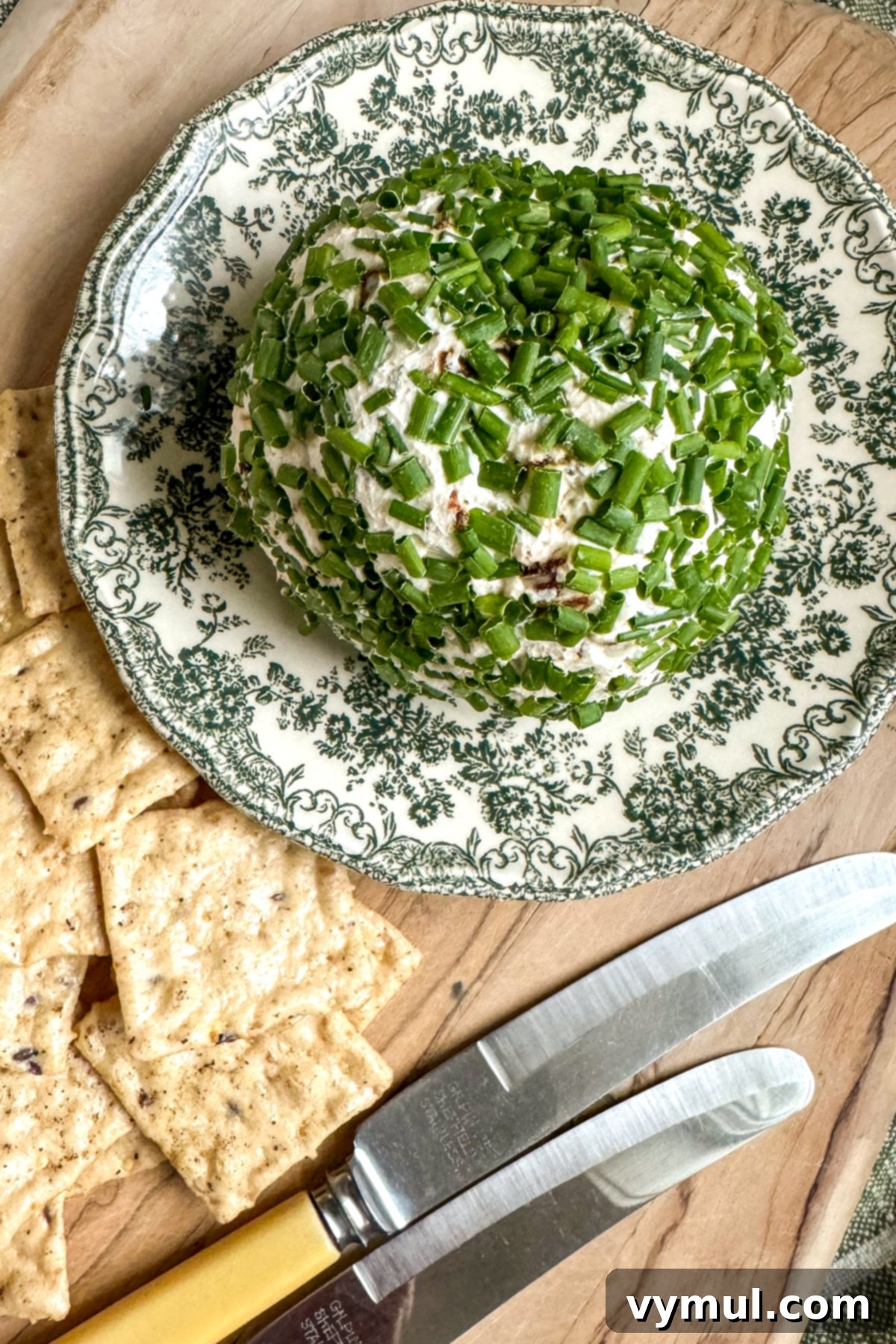 5 Minute Sun Dried Tomato Cheese Ball Quick and Nut Free 7 finished cheese ball on plate with crackers