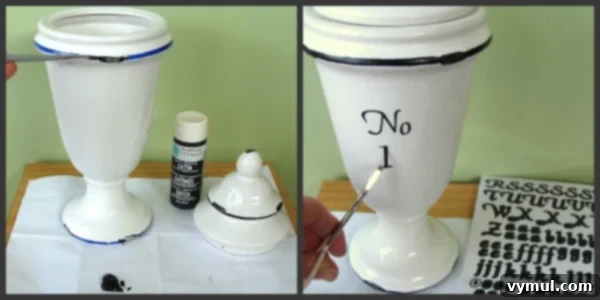 Thrift Store Apothecary Jar Revival 5 Applying black craft paint to the blue rim of a ceramic jar for transformation