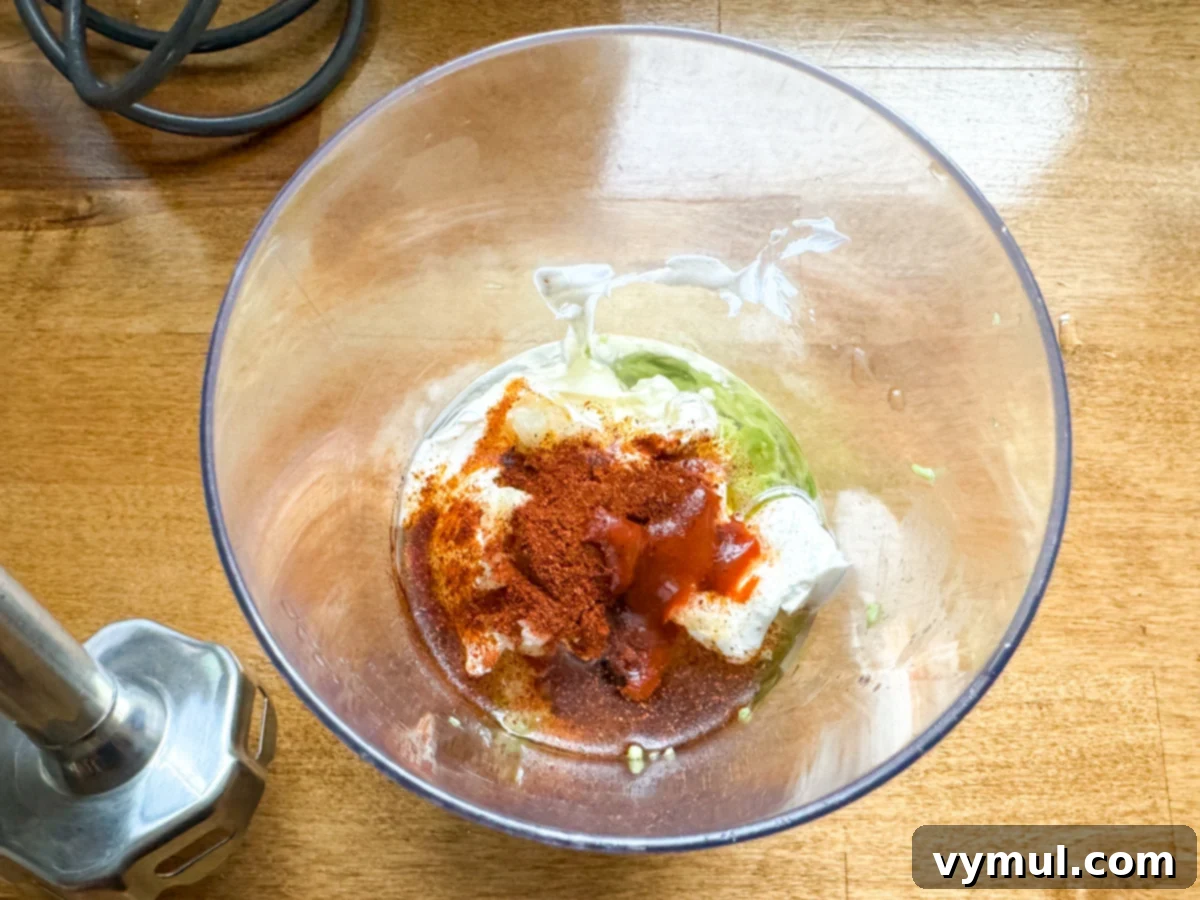 15-Minute Fiesta: Creamy Avocado Salad with Zesty Avocado Dressing 4 making avocado dressing with immersion blender