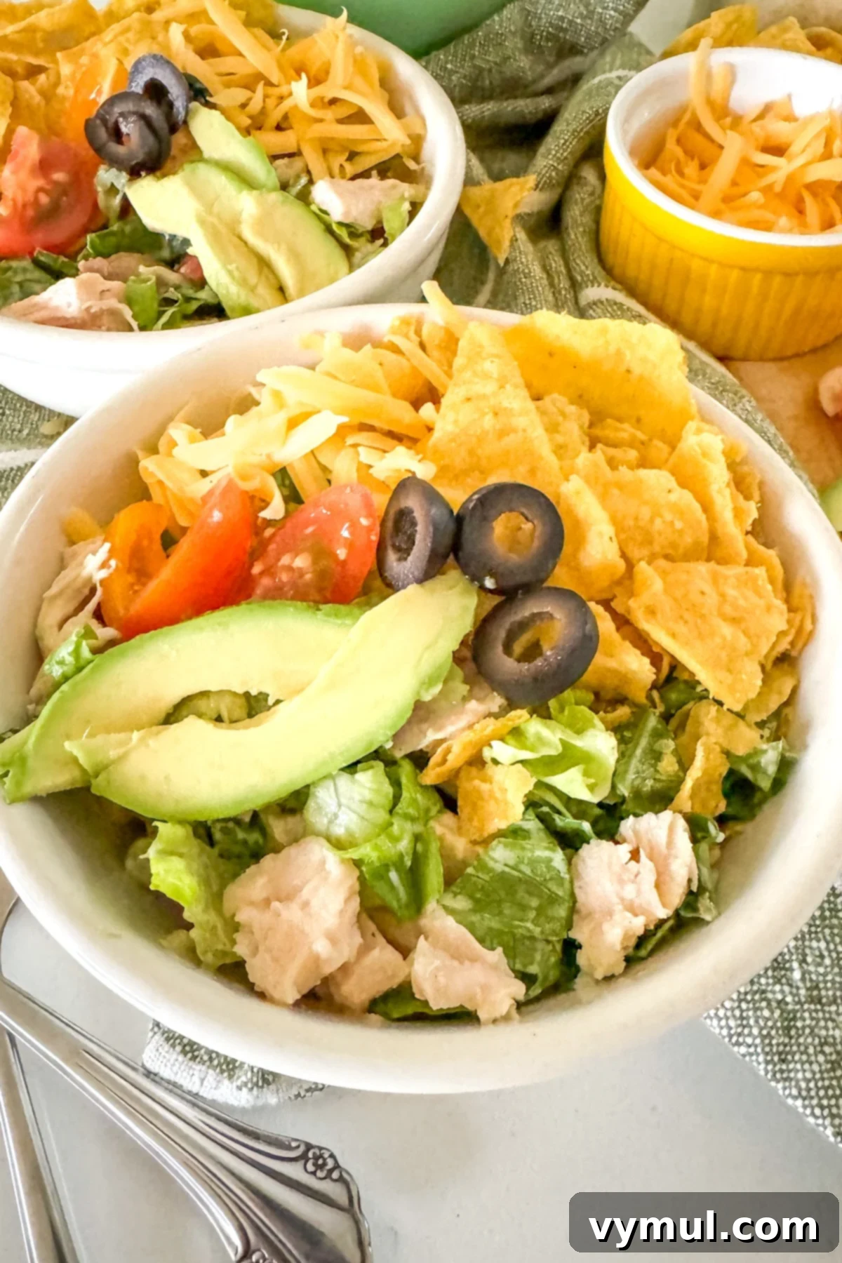 15-Minute Fiesta: Creamy Avocado Salad with Zesty Avocado Dressing 6 avocado salad composed in a white bowl