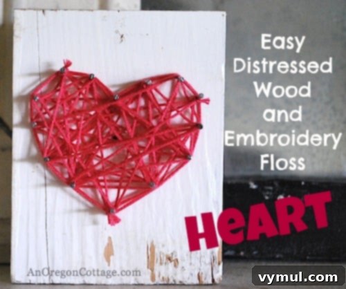 Rustic distressed wood string art heart with pink embroidery floss