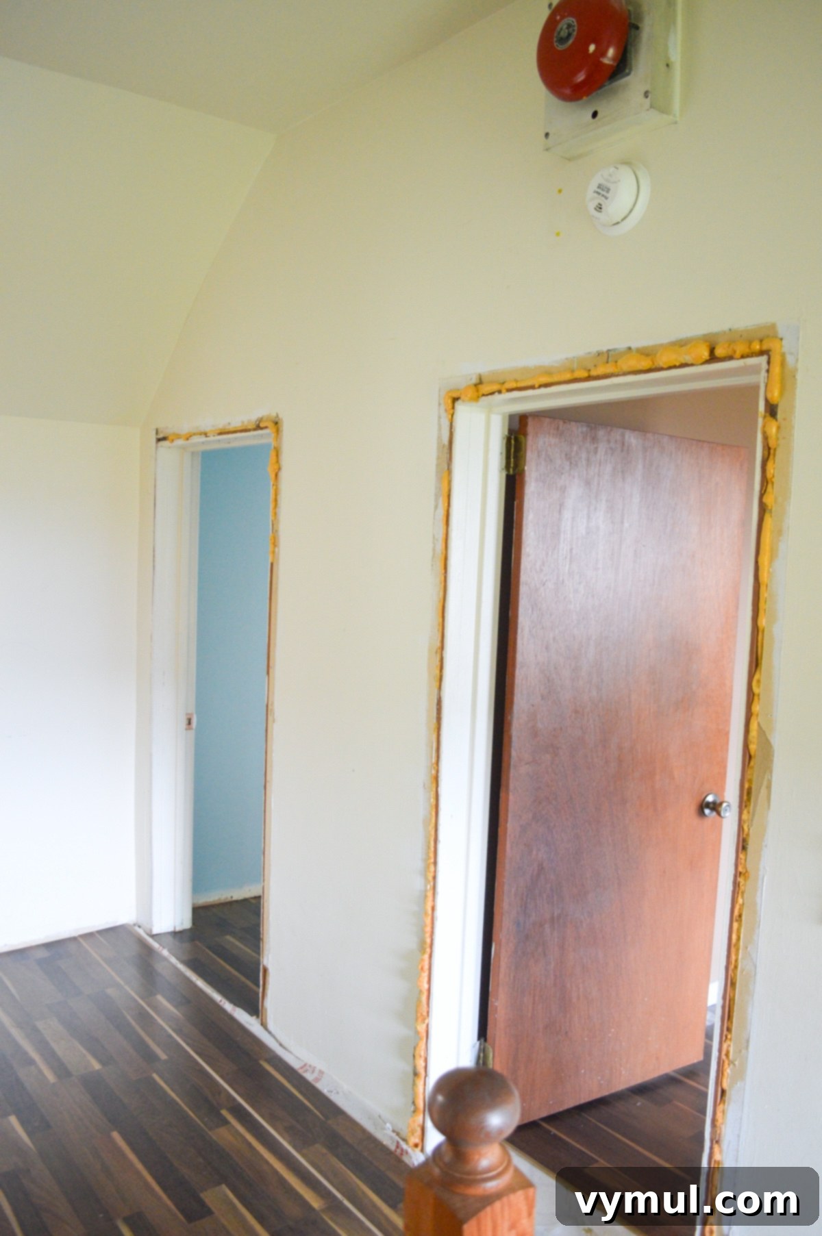 Original, short bedroom doors in the farmhouse before renovation.