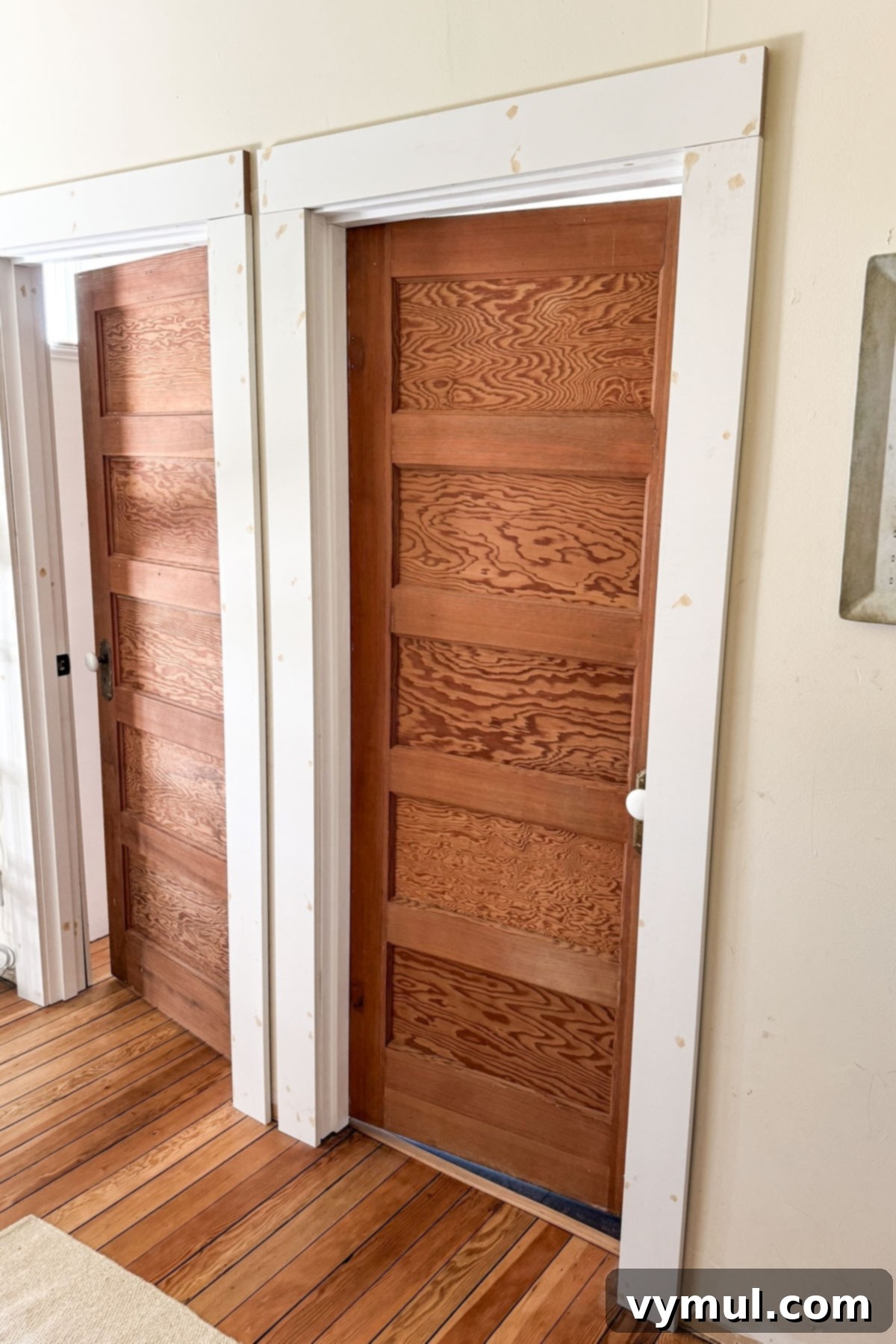 After photo of upstairs bath and office with vintage wood doors and replicated trim.